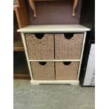 A modern laminated storage unit having four wicker drawers