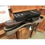 Two guitar cases along with a smaller guitar case (Possible for a ukulele)