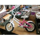 A pink child's bike