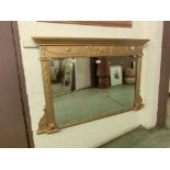 A reproduction 18th century style gilt wood over mantle mirror
