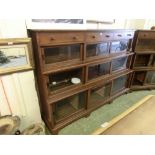 An early 20th century oak bookcase, three drawers over nine glazed sliding doorsDimensions: H: