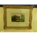 A framed and glazed watercolour of cows before cottage scene after E.M.Wimperis