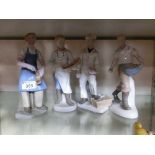 Four Lladro style figurines of young men
