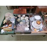 Three trays of ceramic and glassware to include meat plates, dinner plates, drinking vessels etc.