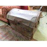 A leather dome topped travelling trunk