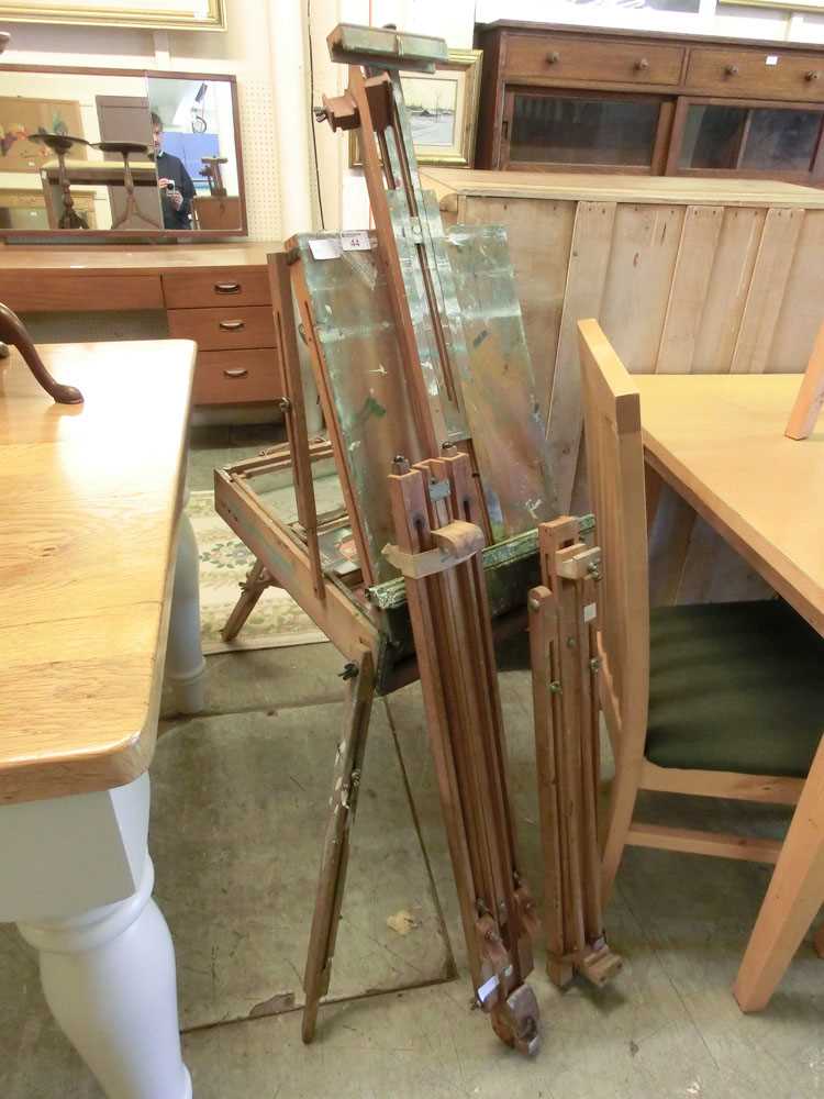 An artist's travelling easel with box along with two other easels, one by Windsor and Newton