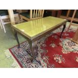 A walnut coffee table with tooled leather insert