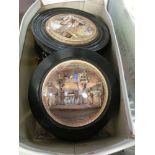 A box containing four mounted pot lids