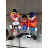 Three glass Murano style clowns