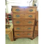 An early 20th century mahogany chest of five drawers on bracket feet