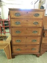 An early 20th century mahogany chest of five drawers on bracket feet