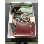 A box containing a large quantity of costume jewellery to include beads, brooches, bracelets, etc