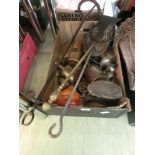 A tray of metalware to include horse brasses, fireside companion set, blowtorches, etc