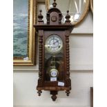 A reproduction drop dial wall clock