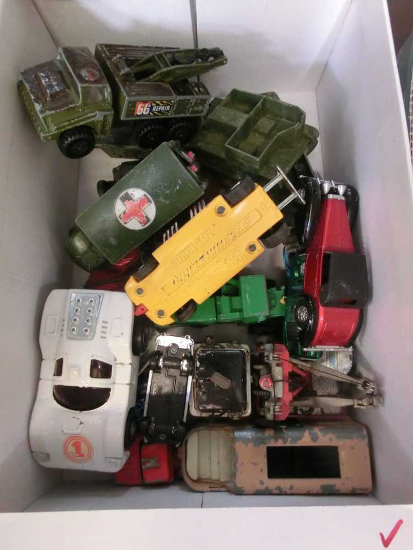 A box containing old diecast toys to include military and agricultural vehicles etc.