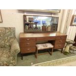 A mid-20th century teak dressing table with triple vanity mirror and stool