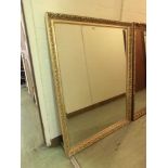 An ornate gilt framed bevel glass mirror
