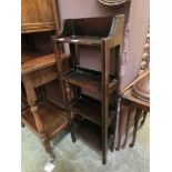 An early 20th century oak slimline bookcase