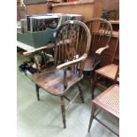 A late 19th century open arm spindle back Windsor chair together with a similar wheel back chair