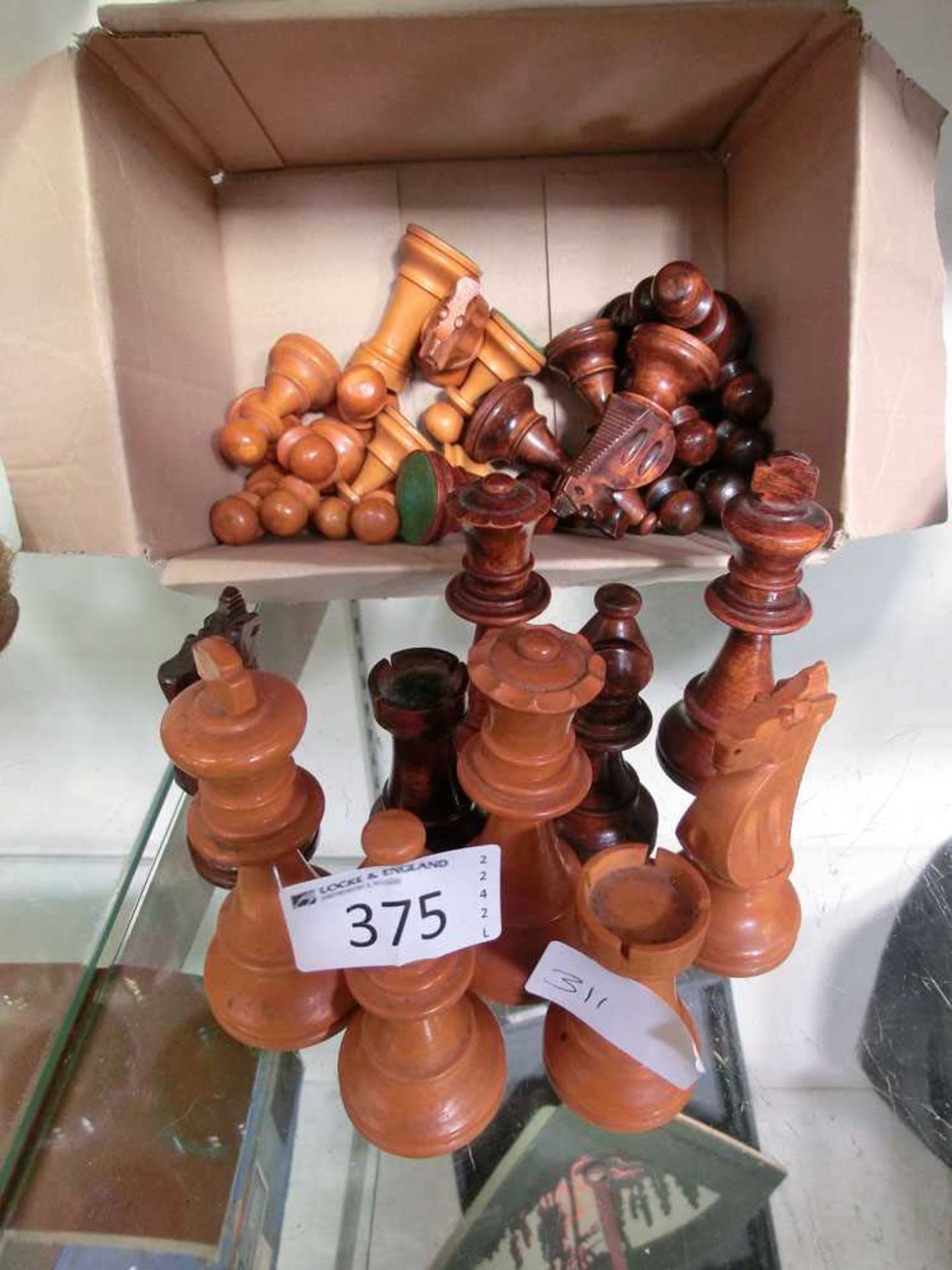 A set of wooden weighted chess pieces