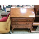 A mid-20th century walnut veneer fall front bureau