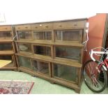 An early 20th century oak bookcase, three drawers over nine glazed sliding doorsDimensions: H: