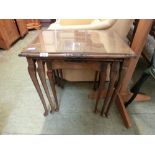 A nest of three walnut occasional tables