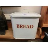 A white enamel and painted bread bin