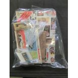 A bag containing trade cards, some in albums