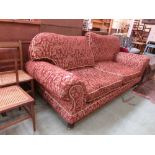 A substantial modern three seat sofa upholstered in a cut red and gold patterned fabricCondition