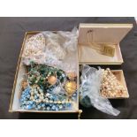 A box containing a quantity of costume jewellery, mainly beads