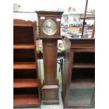 An early 20th century oak cased granddaughter clock