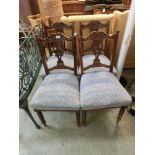 A set of four Edwardian walnut dining chairs