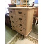 A 19th century pine chest of two short over three long drawers on turned feet