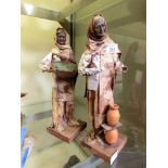 Two Mexican papier mache models of people