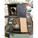 Two trays containing an early 20th century magic lighting projector, glass slides, lenses etc.