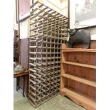 A substantial wood and metalwork wine rack