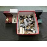 A box containing a quantity of gent's and lady's wristwatches