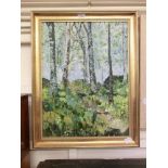 A gilt framed oil of wooded scene