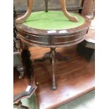 A reproduction mahogany effect drum table