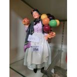 A Royal Doulton figurine 'Biddy Penny Farthing'