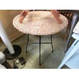 A wicker top occasional table