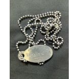 A white metal Tiffany and Co tag, marked 'Sterling 925' on beaded chain