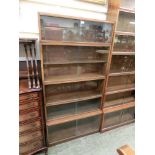 A mid-20th century four section glazed bookcase