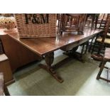 An early 20th century drawer leaf refectory style dining table