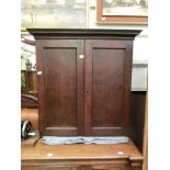 A Georgian oak two door cupboard