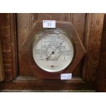An early 20th century oak cased barometer.