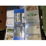 A tray containing a large quantity of postcards, some in albums