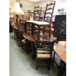 A mid-20th century oak gate leg table with a set of four matching chairs