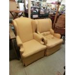 A yellow upholstered wing armchair together with one other similarly upholstered chair